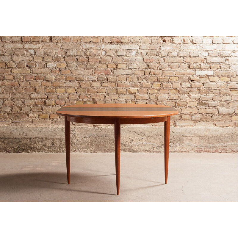 Vintage round teak table with black central extension