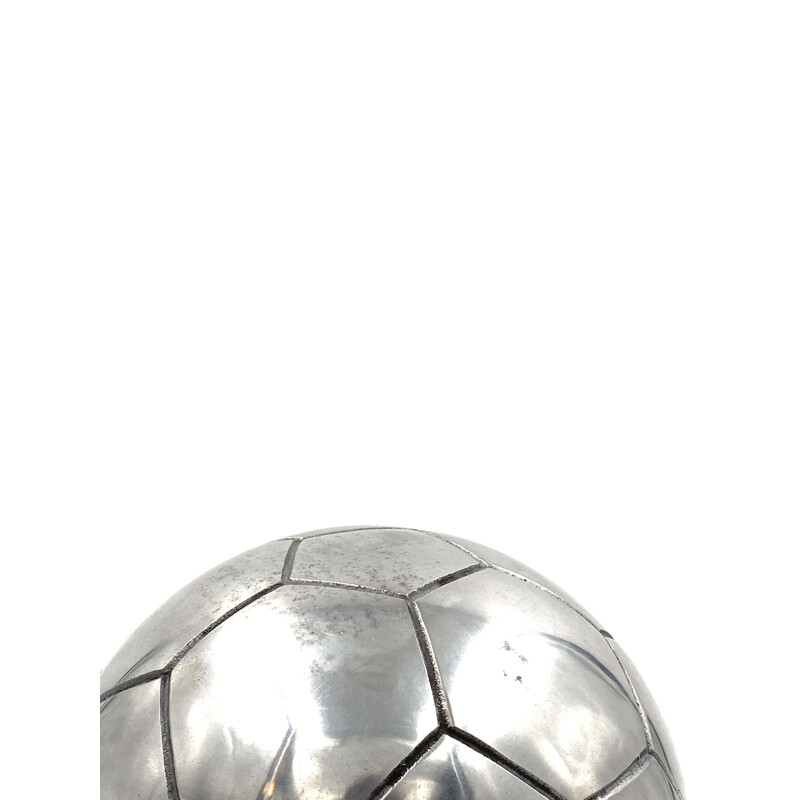 Vintage sculpture of a football in polished aluminium