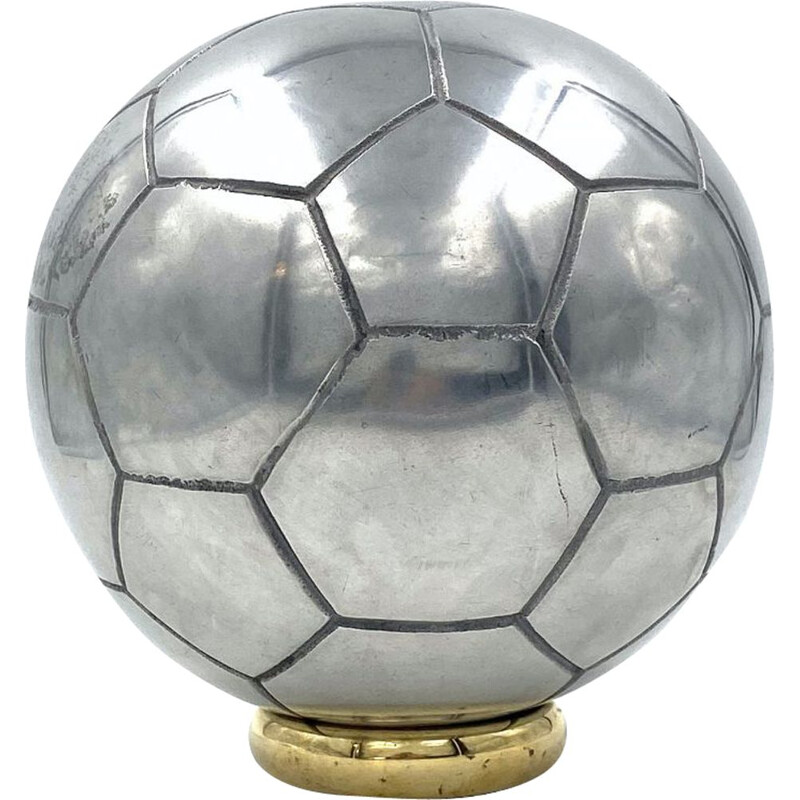 Vintage sculpture of a football in polished aluminium