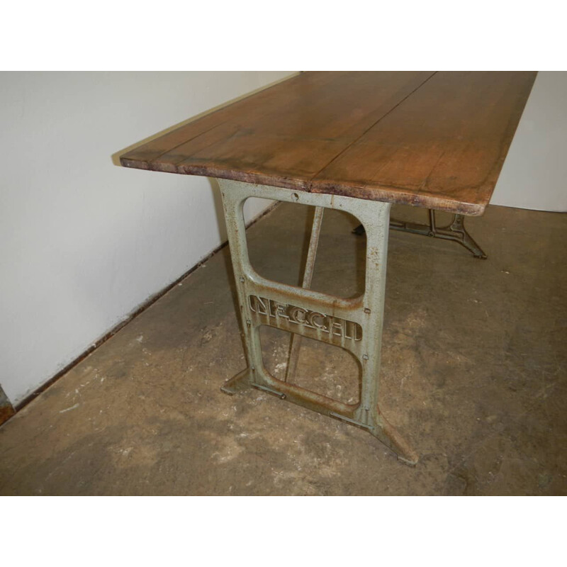 Vintage beechwood table on on Necchi cast iron bases