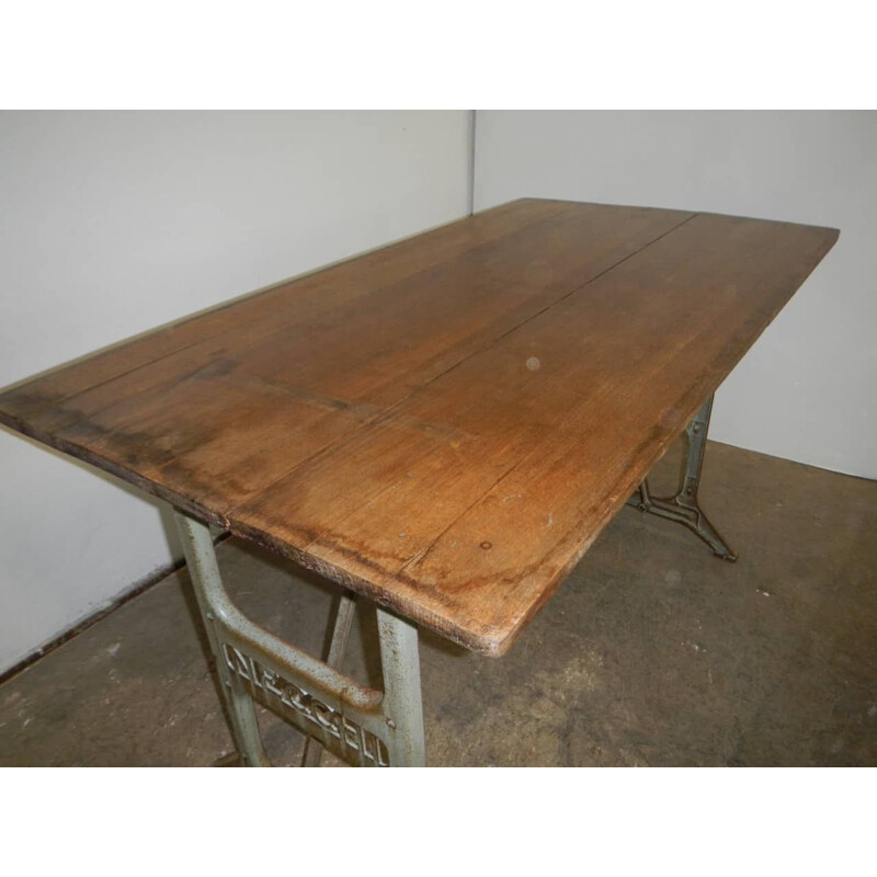 Vintage beechwood table on on Necchi cast iron bases