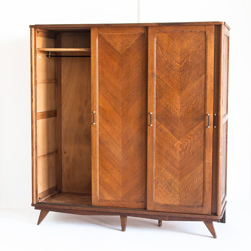 Vintage three-door sliding oak closet, France 1960