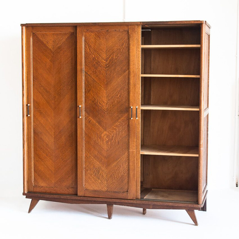 Vintage three-door sliding oak closet, France 1960