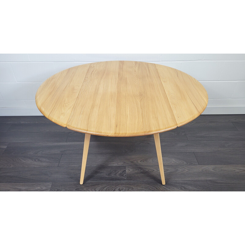 Vintage round table with wooden top by Ercol, 1960