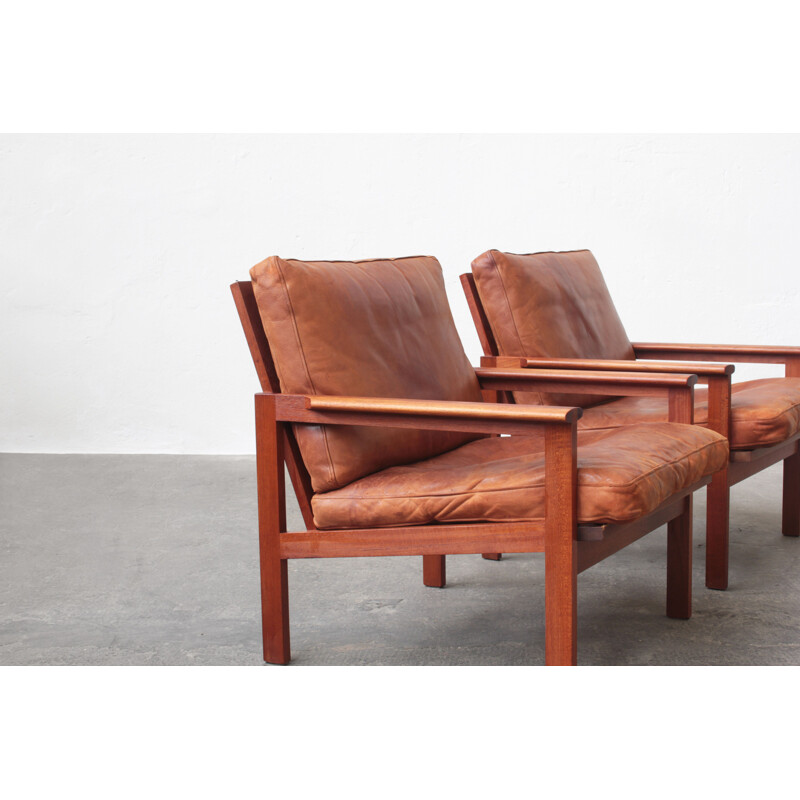 Pair of vintage leather and teak wood armchairs by Illum Wikkelsø for Niels Eilersen, Danish 1960s