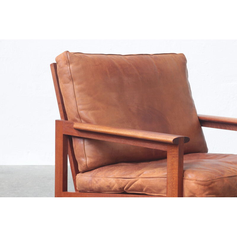 Pair of vintage leather and teak wood armchairs by Illum Wikkelsø for Niels Eilersen, Danish 1960s