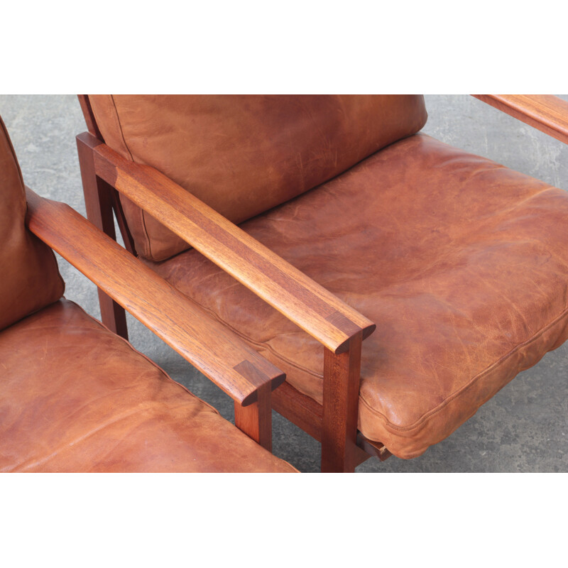 Pair of vintage leather and teak wood armchairs by Illum Wikkelsø for Niels Eilersen, Danish 1960s