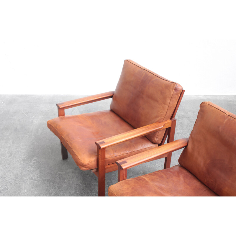 Pair of vintage leather and teak wood armchairs by Illum Wikkelsø for Niels Eilersen, Danish 1960s