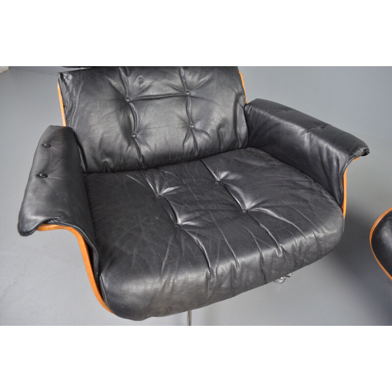 Fauteuil lounge avec ottoman vintage en palissandre et cuir noir par Martin Stoll