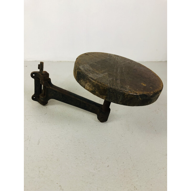 Pair of vintage cast iron and oakwood wall stools