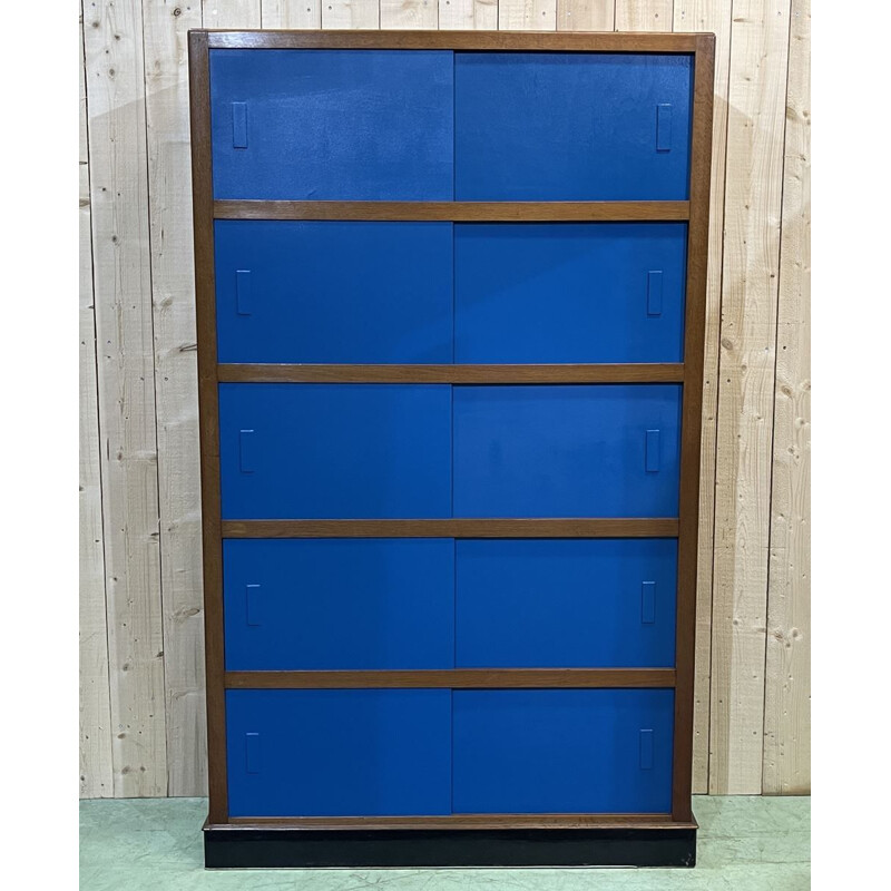 Vintage school cabinet in oakwood and sliding hardboard doors, 1930