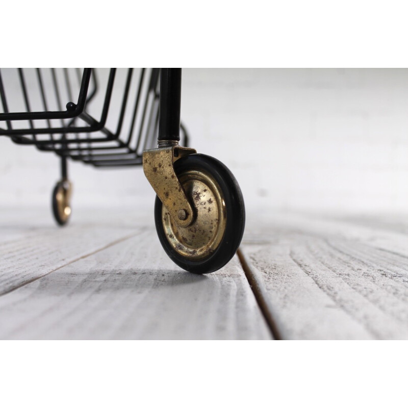 Mid-century magazine rack in black lacquered metal on wheels - 1960s