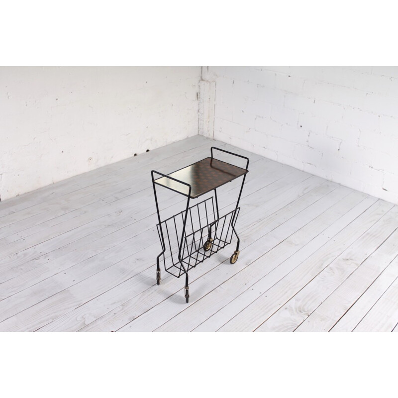 Mid-century magazine rack in black lacquered metal on wheels - 1960s