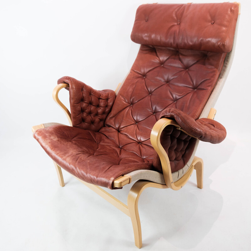 Vintage Pernilla red leather lounge chair with ottomane by Bruno Mathsson, 1970s