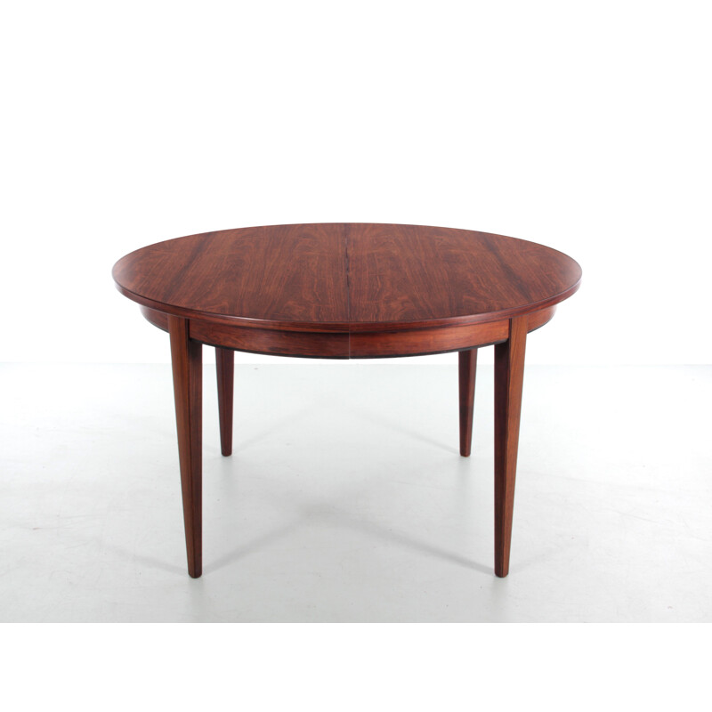 Scandinavian vintage round table with 3 extensions in Rio rosewood