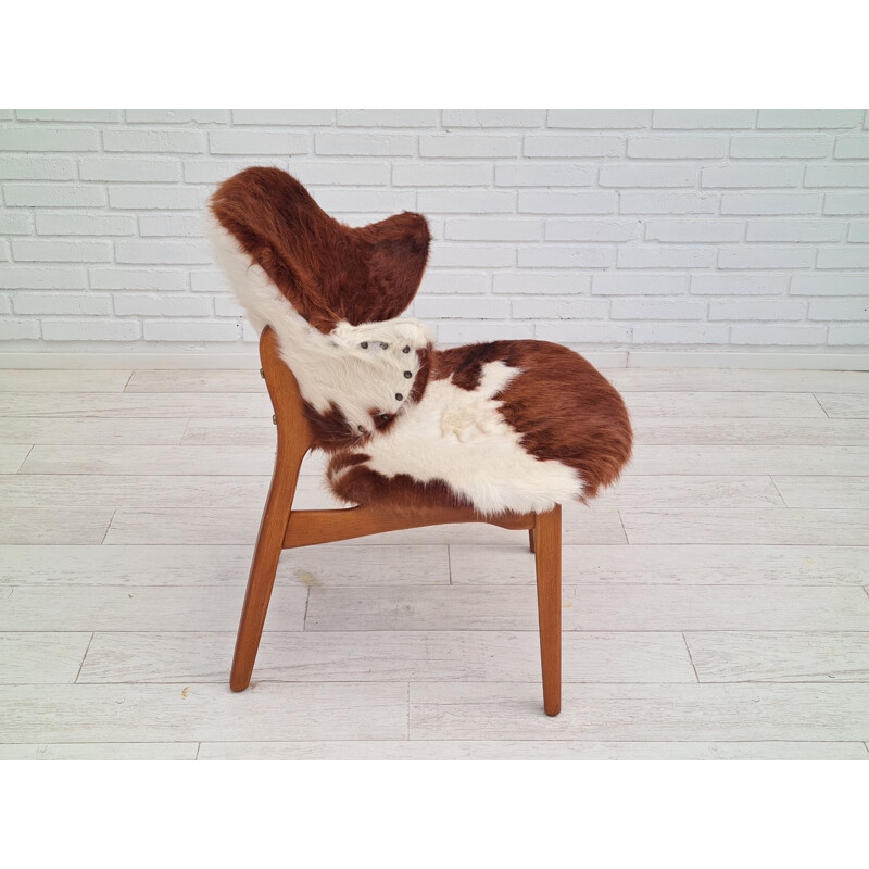 Danish vintage cowhide chair by Ib Kofod Larsen for Christensen & Larsen, 1970s