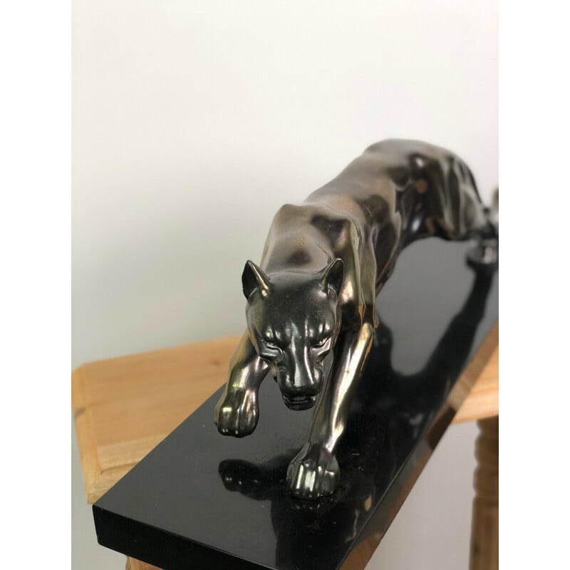 Vintage tiger in regula on black marble base