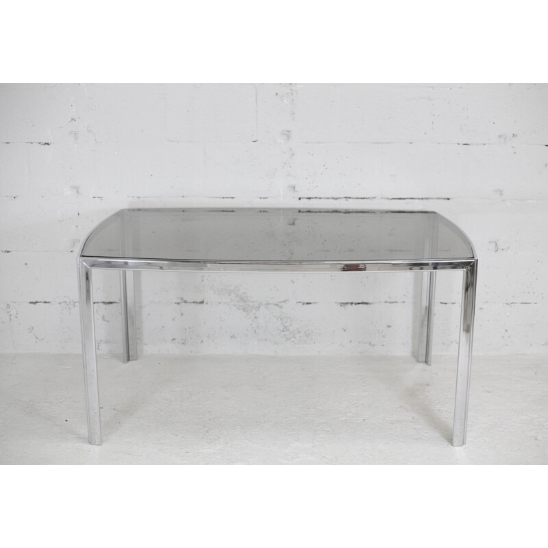Vintage living room table in chrome-plated metal and curved smoked glass slab, France 1970s