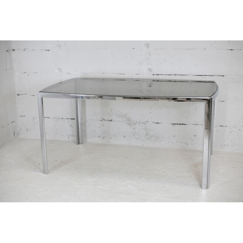 Vintage living room table in chrome-plated metal and curved smoked glass slab, France 1970s