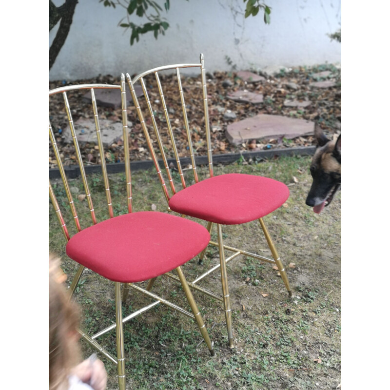 Coppia di sedie vintage in metallo dorato e seduta in tessuto rosso