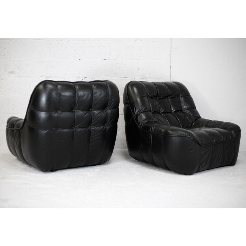 Pair of vintage black leather armchairs, France circa 1970