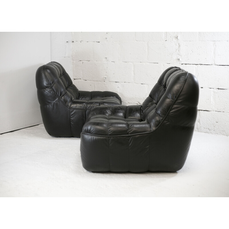 Pair of vintage black leather armchairs, France circa 1970