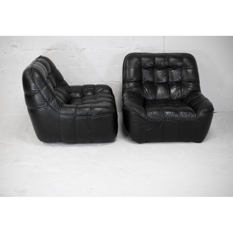 Pair of vintage black leather armchairs, France circa 1970