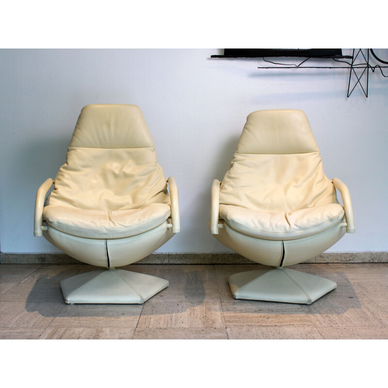 Pair of vintage leather swivel armchairs on pentagonal base