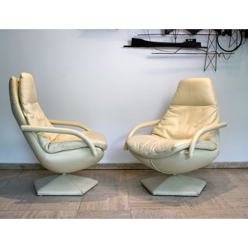 Pair of vintage leather swivel armchairs on pentagonal base