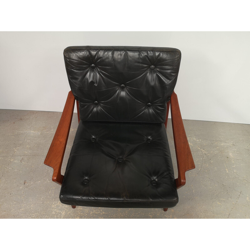 Sillón vintage escandinavo de teca y cuero negro, 1970