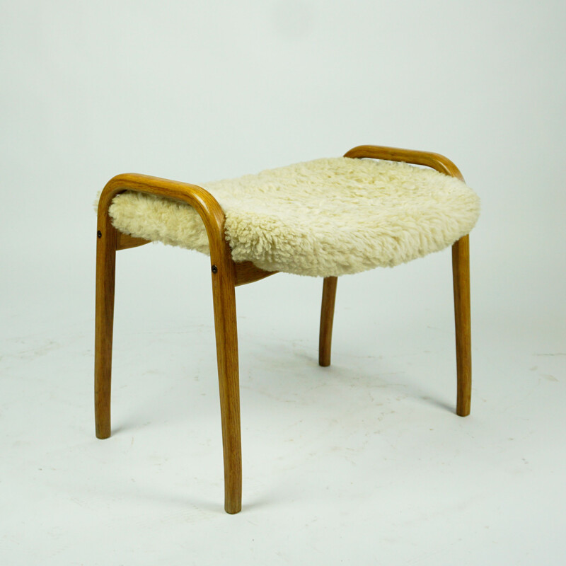 Vintage oakwood and white sheepskin lamino footrest by Yngve Ekstrom for Swedese, Sweden 1950s