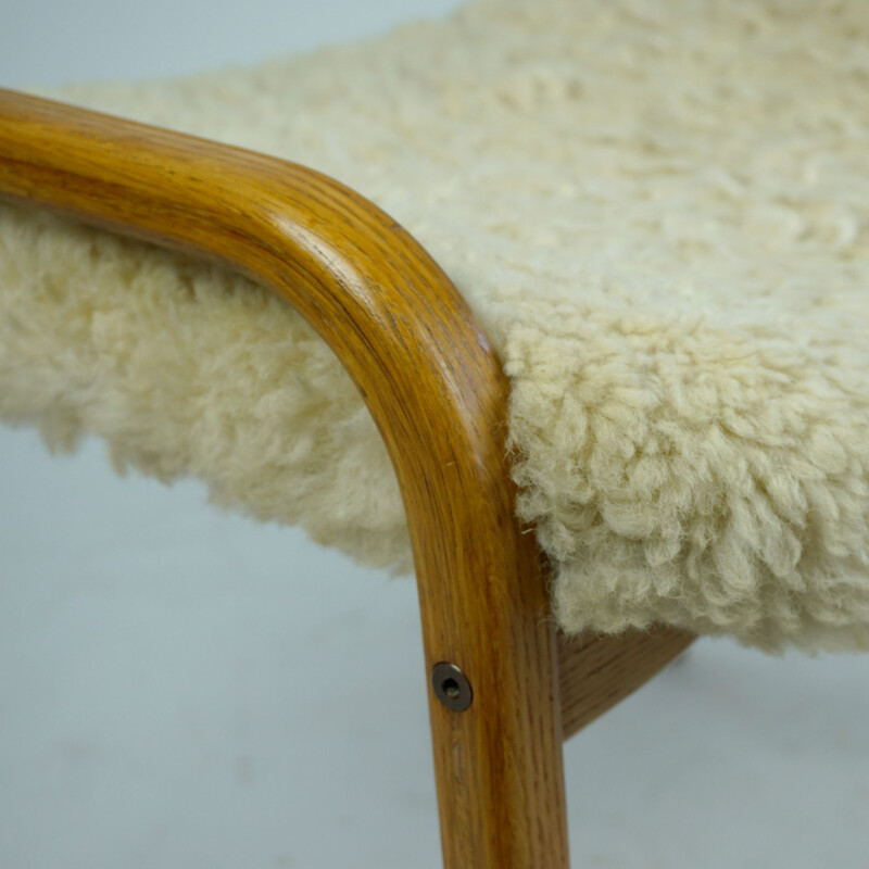 Vintage oakwood and white sheepskin lamino footrest by Yngve Ekstrom for Swedese, Sweden 1950s