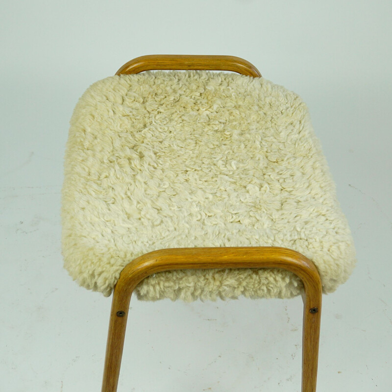 Vintage oakwood and white sheepskin lamino footrest by Yngve Ekstrom for Swedese, Sweden 1950s