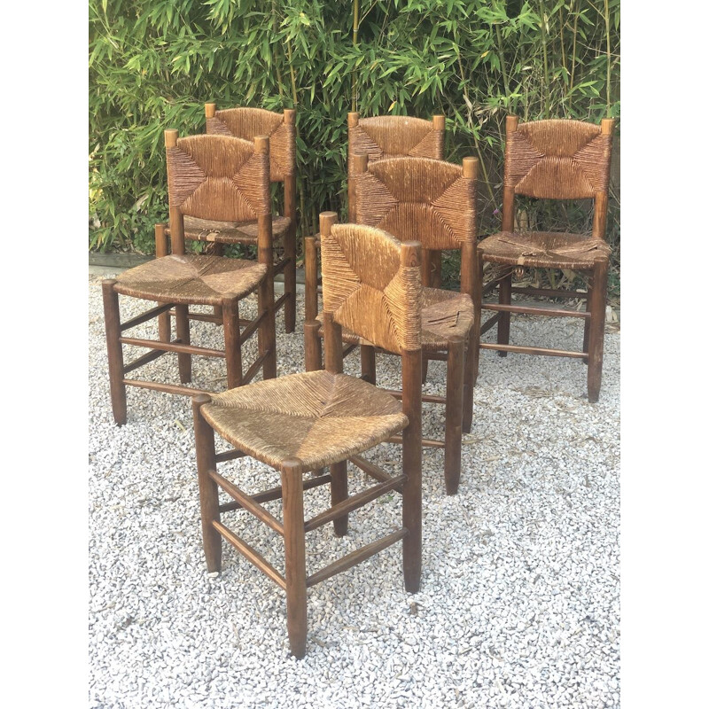 Ensemble de 6 chaises vintage en bois massif teinté et paille par Charlotte Perriand pour Blanchon, 1950