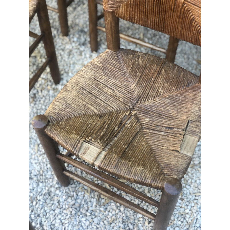 Set of 6 vintage stained wood and straw chairs by Charlotte Perriand for Blanchon, 1950