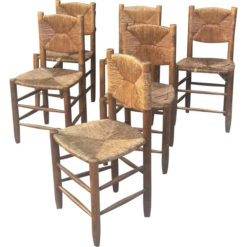 Set of 6 vintage stained wood and straw chairs by Charlotte Perriand for Blanchon, 1950