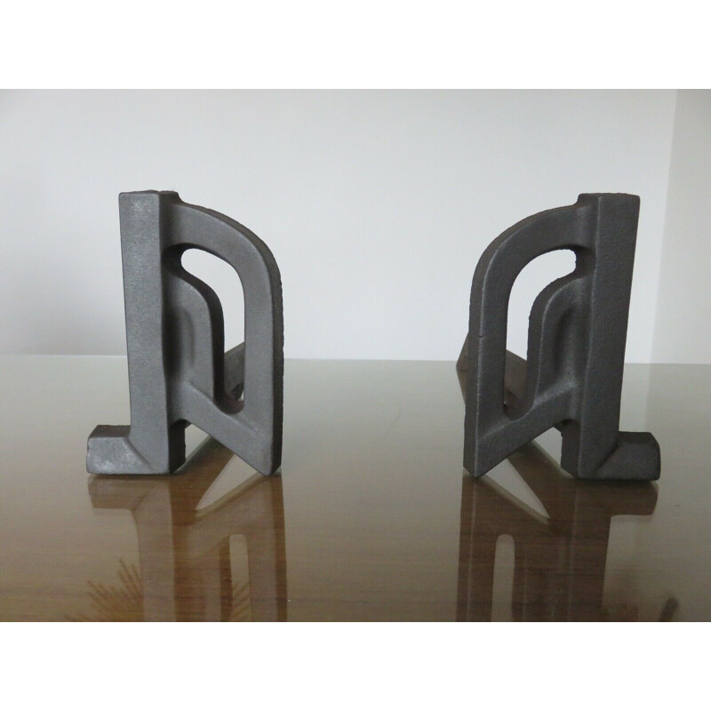 Pair of vintage modernist cast iron andirons, 1960