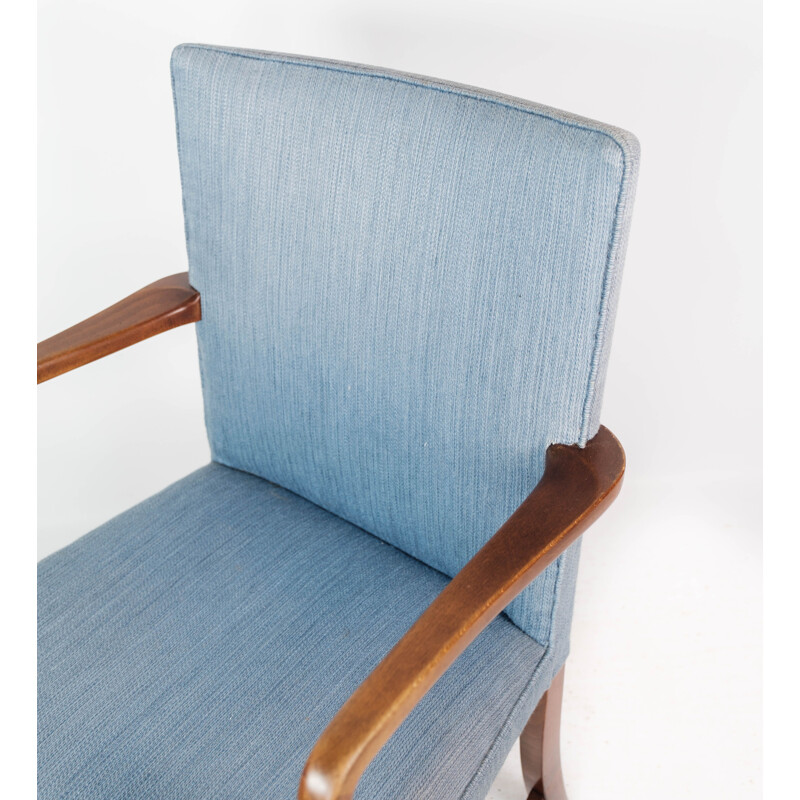 Vintage armchair in mahogany and upholstered with light blue fabric by Fritz Hansen