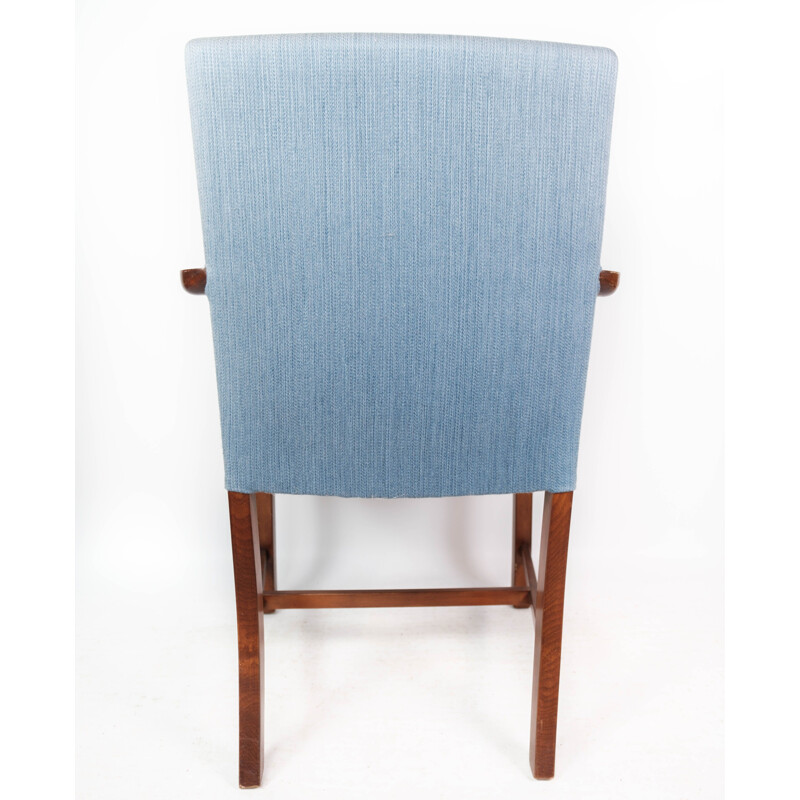 Vintage armchair in mahogany and upholstered with light blue fabric by Fritz Hansen