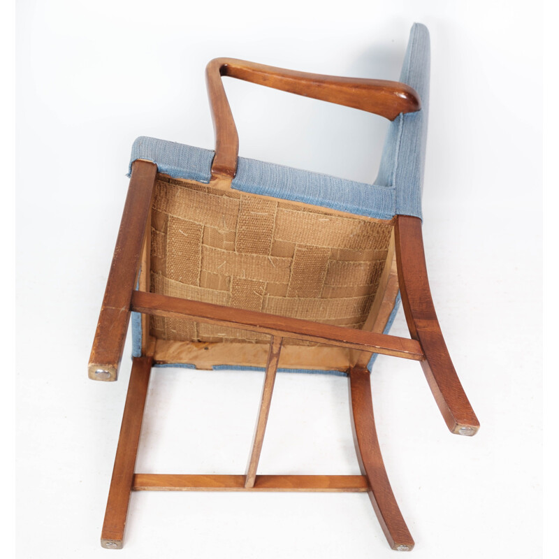 Vintage armchair in mahogany and upholstered with light blue fabric by Fritz Hansen