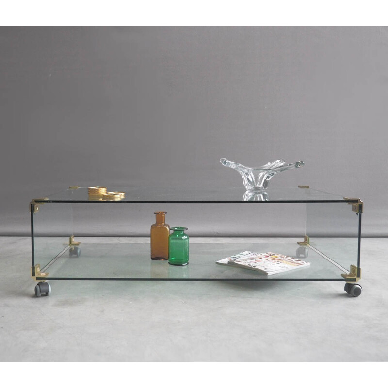 Large glass and brass coffee table on wheels - 1970s