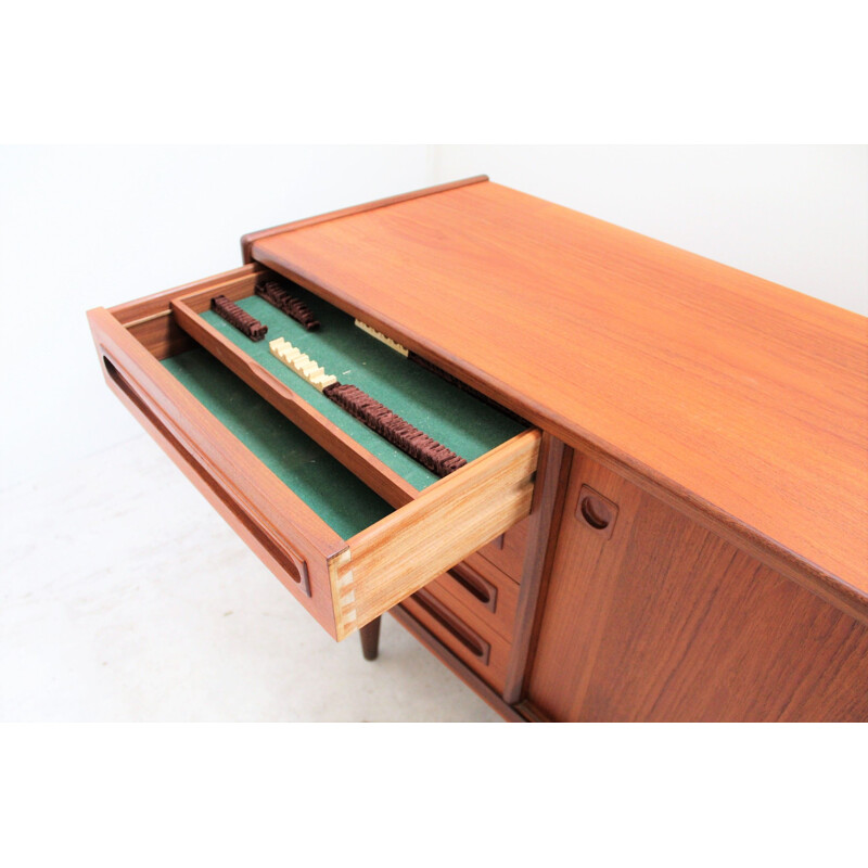 Vintage teak sideboard with 2 sliding doors and 4 drawers by Johannès Andersen
