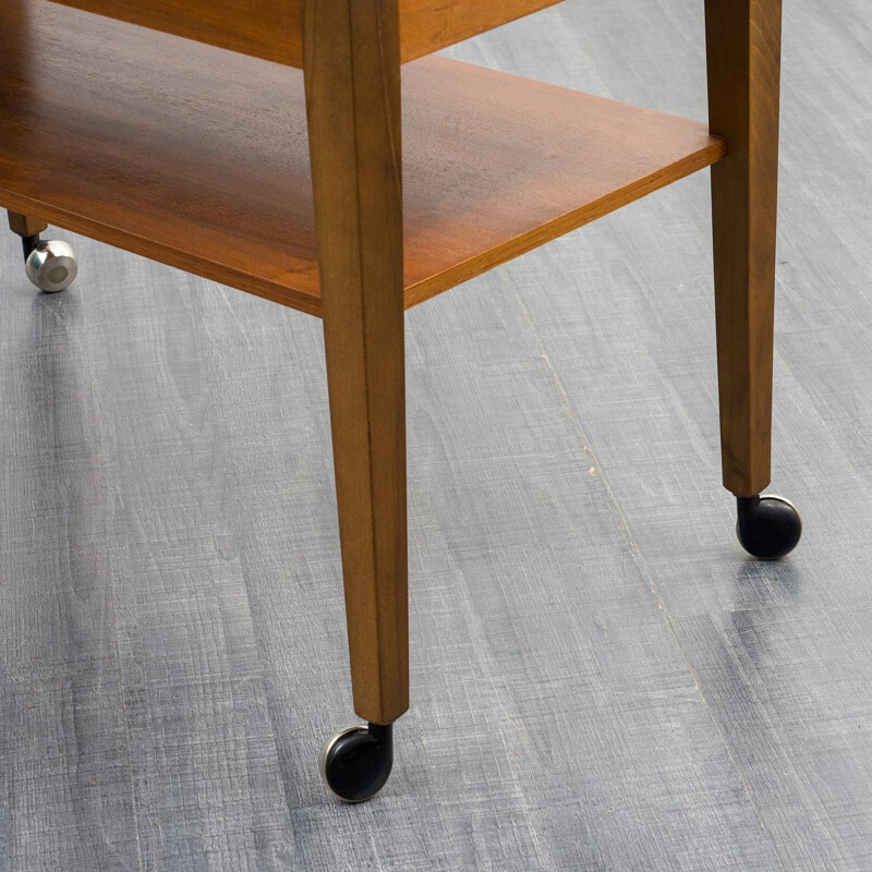 Vintage side table in walnut on castors, 1960s