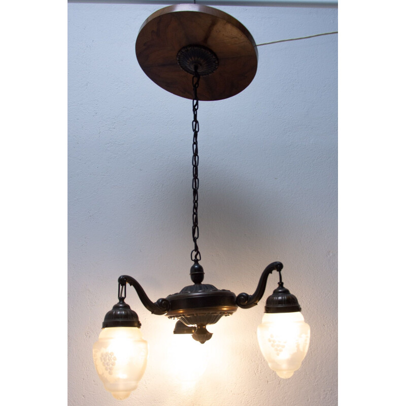 Historicizing three-armed vintage brass chandelier