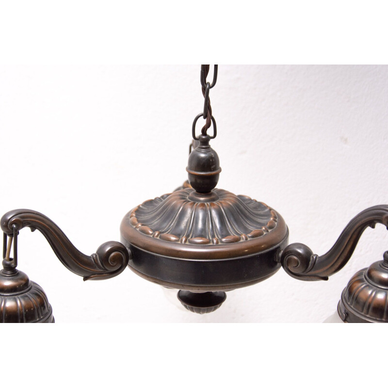 Historicizing three-armed vintage brass chandelier