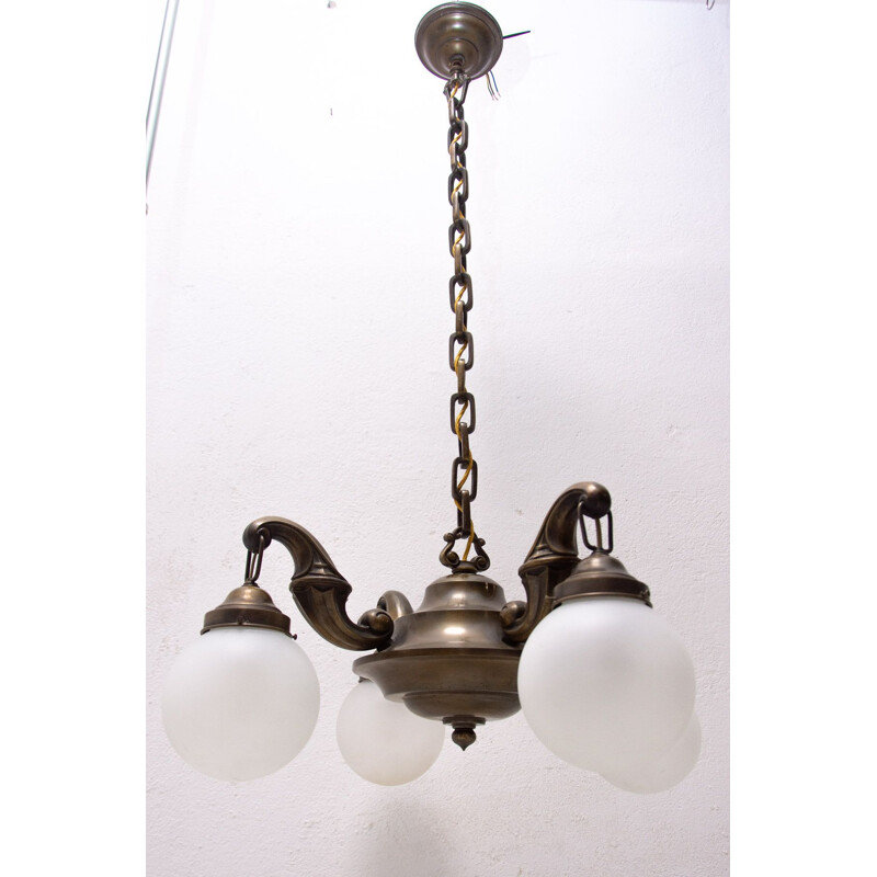 Vintage chandelier with four brass arms