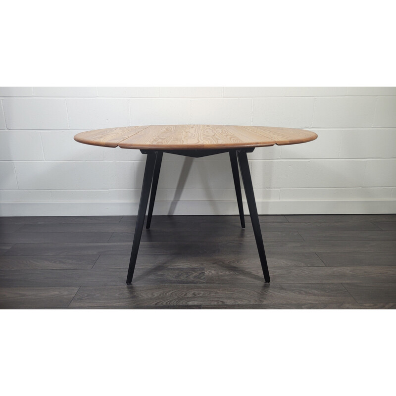 Vintage round drop leaf dining table by Ercol, 1960s