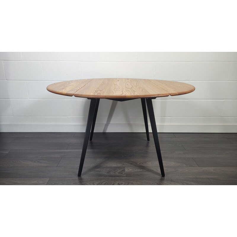 Vintage round drop leaf dining table by Ercol, 1960s