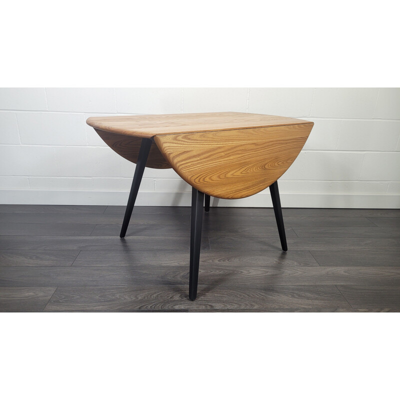 Vintage round drop leaf dining table by Ercol, 1960s