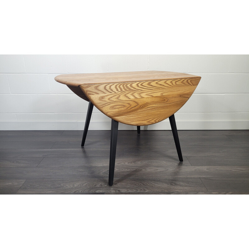 Vintage round drop leaf dining table by Ercol, 1960s